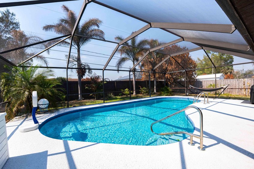 Welcome to this 4 bedroom, 2 bathroom pool home featuring a - photo 2