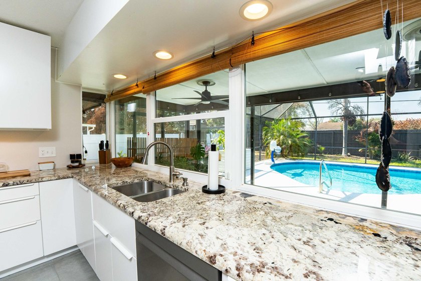Welcome to this 4 bedroom, 2 bathroom pool home featuring a - photo 10