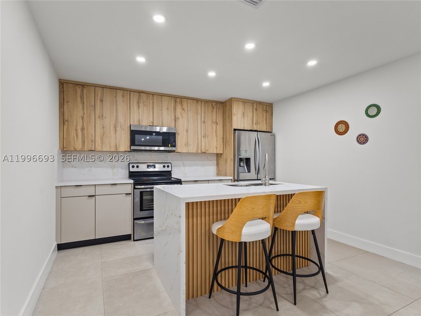 Fully renovated and move-in ready townhome offering a functional - photo 11