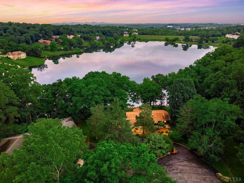 Nestled at the end of a private drive, this lakeside sanctuary - photo 2
