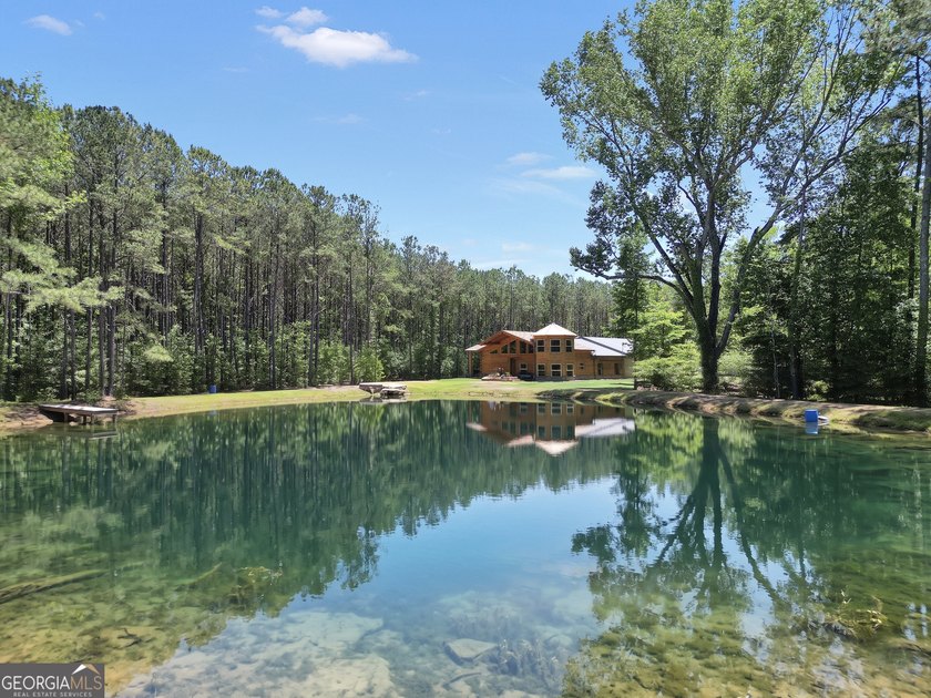 Beautifully custom-built log cabin style home privately situated - photo 2