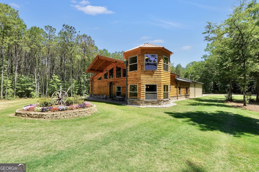 Beautifully custom-built log cabin style home privately situated - photo 3