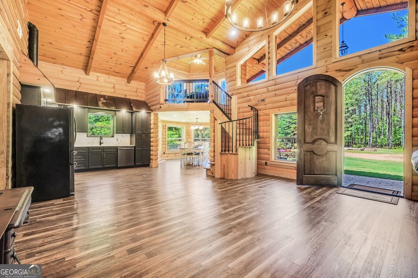 Beautifully custom-built log cabin style home privately situated - photo 10