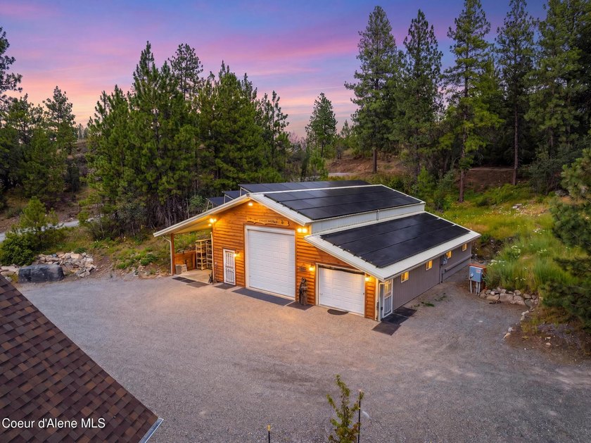 Stunning sunsets frame this custom designed Craftsman that sits - photo 2