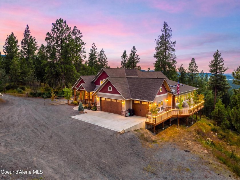 Stunning sunsets frame this custom designed Craftsman that sits - photo 3