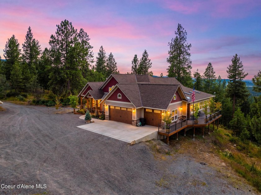 Stunning sunsets frame this custom designed Craftsman that sits - photo 4