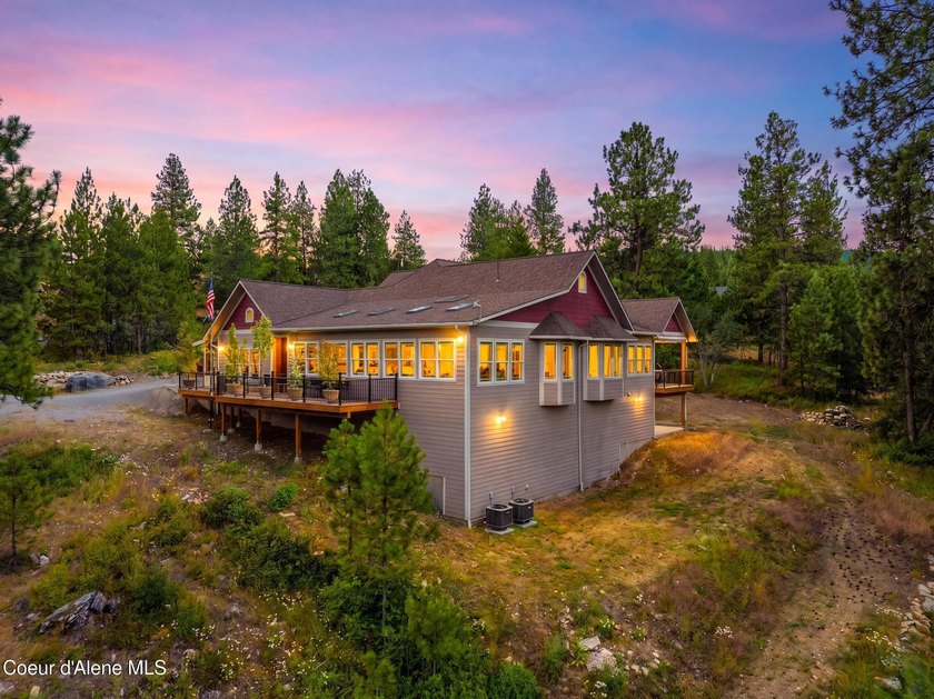 Stunning sunsets frame this custom designed Craftsman that sits - photo 6