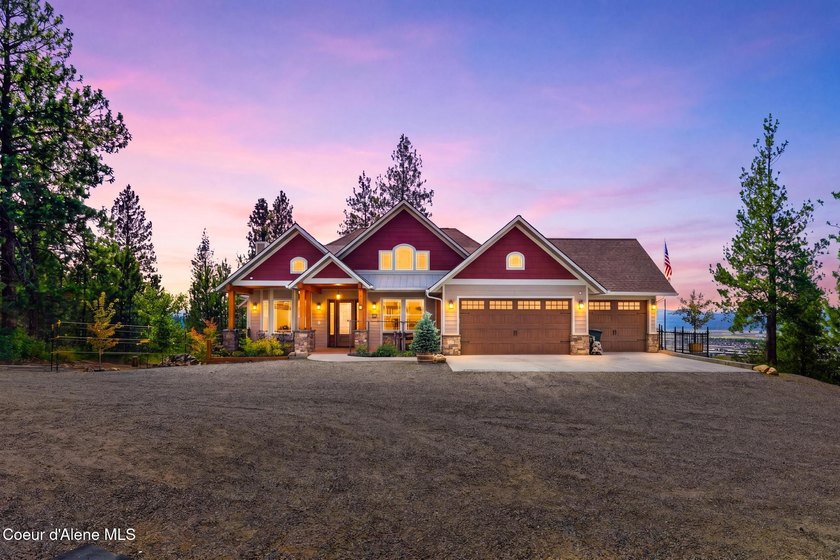 Stunning sunsets frame this custom designed Craftsman that sits - photo 9