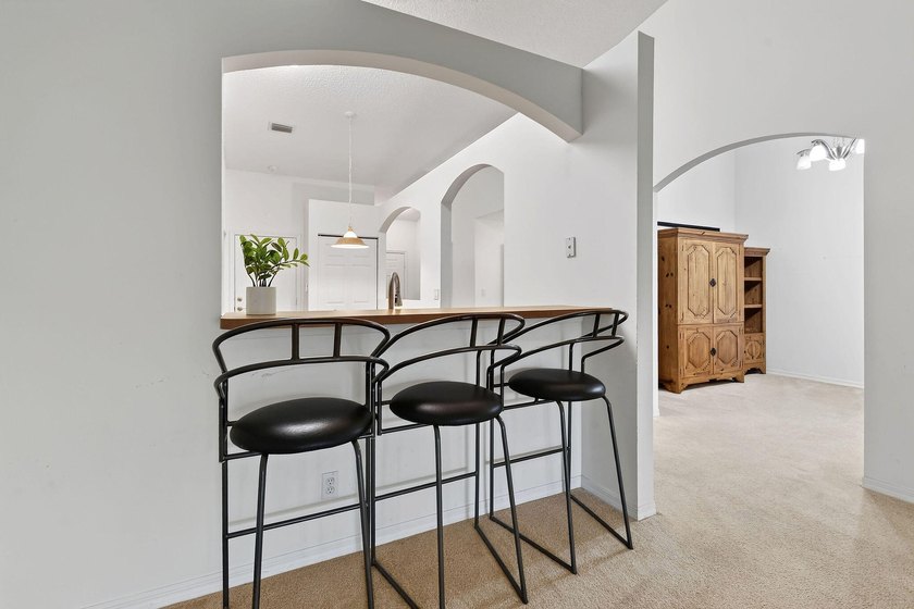 A MUST-See! This charming NEW 2025 ROOF and lakefront villa is - photo 18