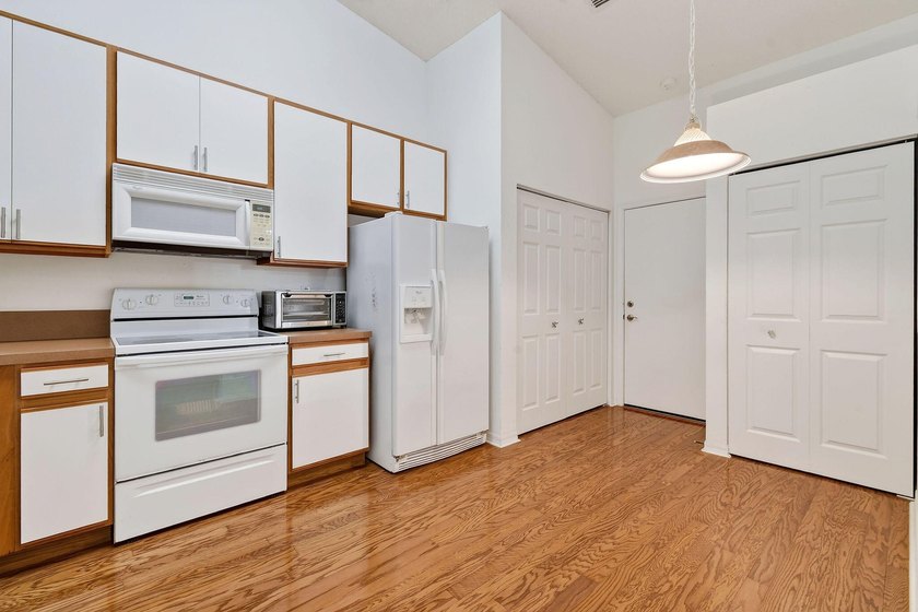 A MUST-See! This charming NEW 2025 ROOF and lakefront villa is - photo 23