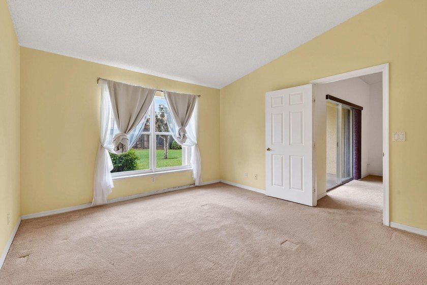A MUST-See! This charming NEW 2025 ROOF and lakefront villa is - photo 28