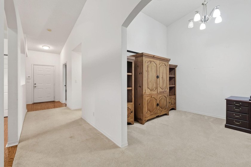 A MUST-See! This charming NEW 2025 ROOF and lakefront villa is - photo 32