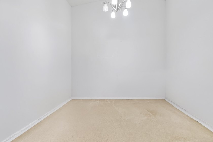 A MUST-See! This charming NEW 2025 ROOF and lakefront villa is - photo 34