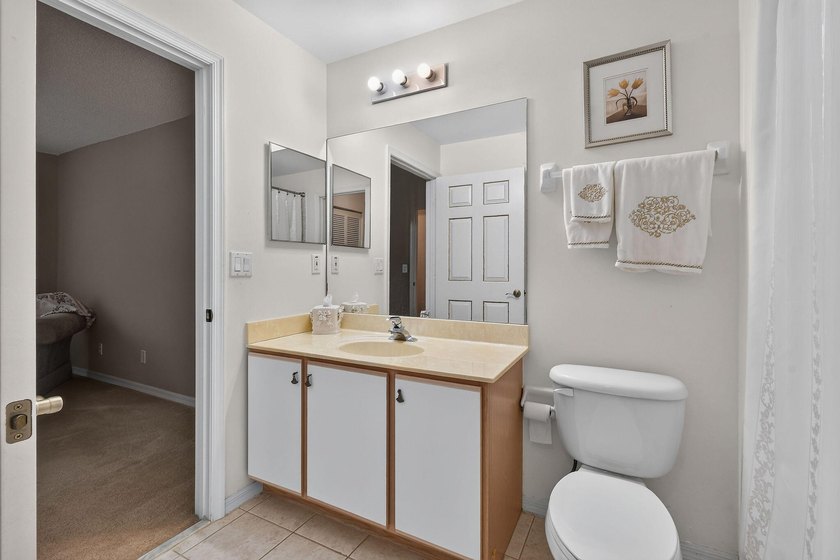 A MUST-See! This charming NEW 2025 ROOF and lakefront villa is - photo 41