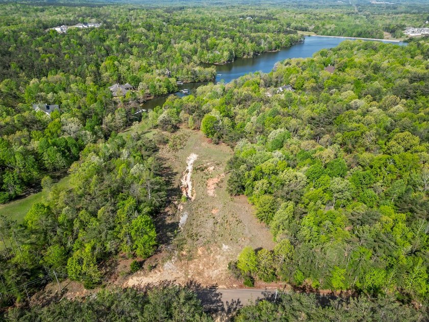 Beautiful 5.48+/- acre dream lot in THE HIGHLANDS! Features a - photo 3