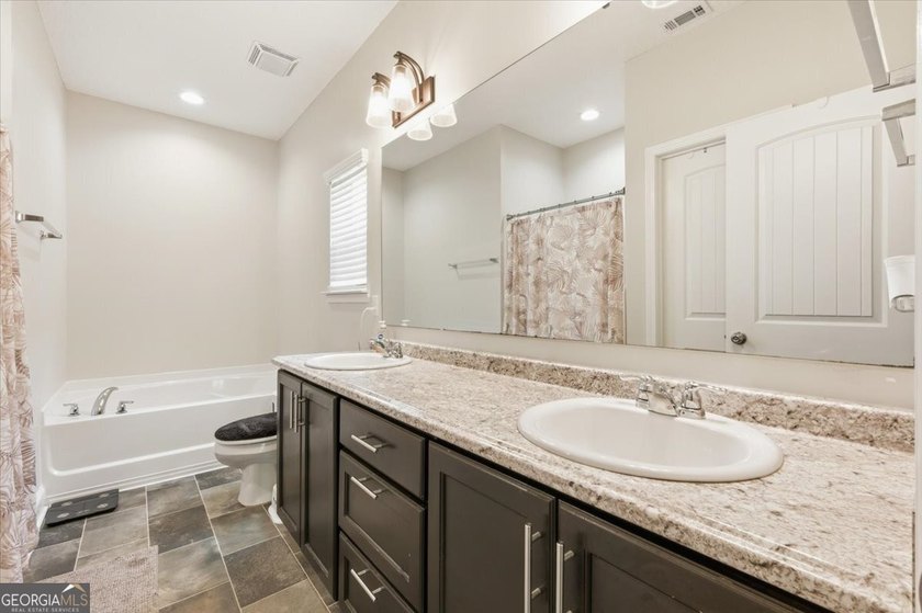 This home is immediately set apart by the custom design - photo 8