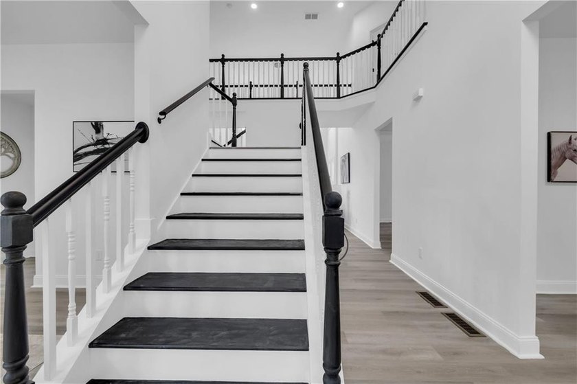 This stunning newly built residence in Douglasville offers the - photo 2
