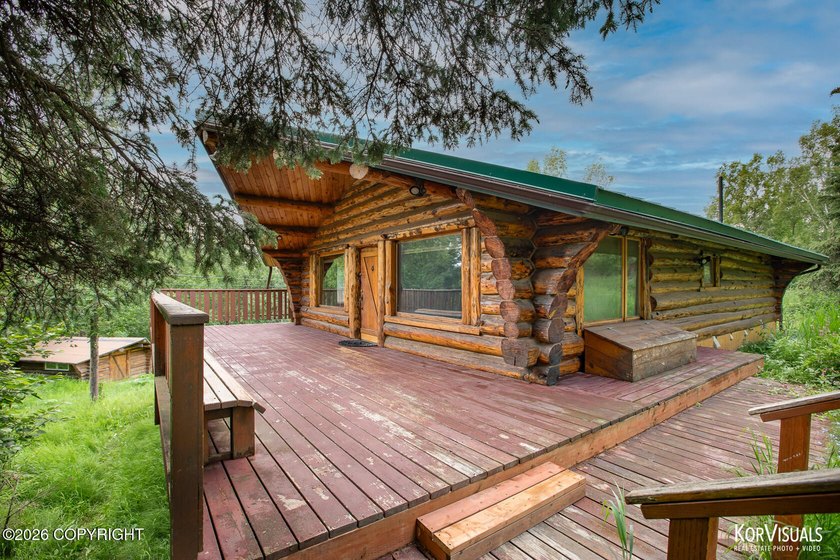 Experience the warmth and character of log home living in this - photo 4