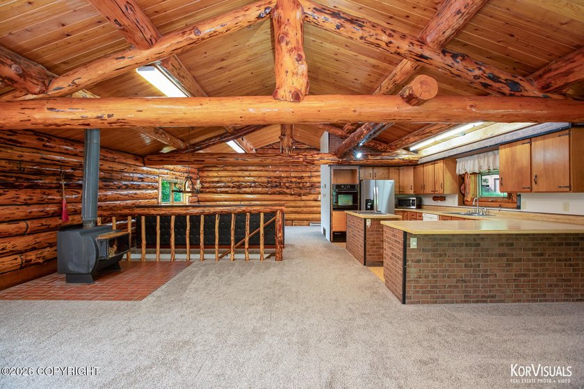 Experience the warmth and character of log home living in this - photo 5