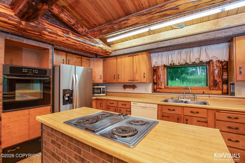 Experience the warmth and character of log home living in this - photo 10
