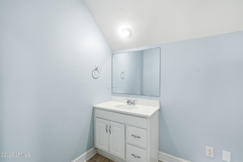 Welcome to Royal Pines! This spacious 5-bedroom, 3-bath with a 2 - photo 31