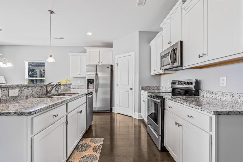 Welcome to this immaculate, move-in-ready four-bedroom, two full - photo 11