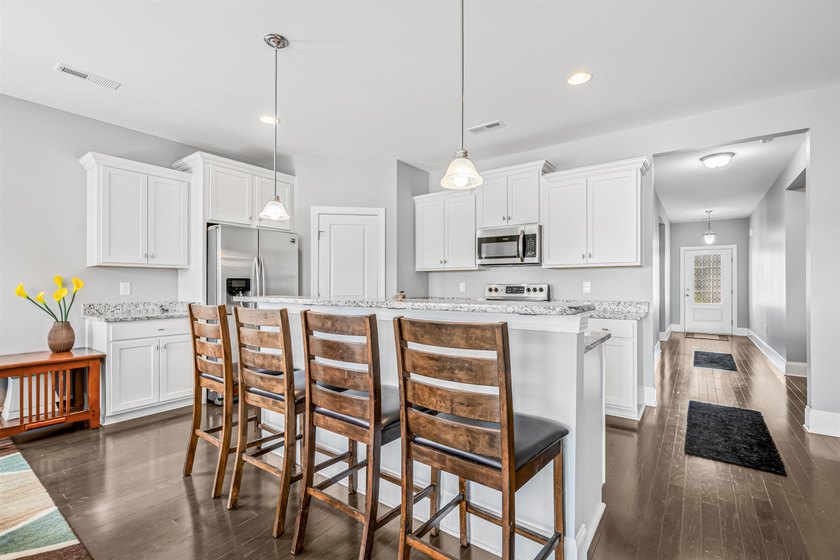 Welcome to this immaculate, move-in-ready four-bedroom, two full - photo 13