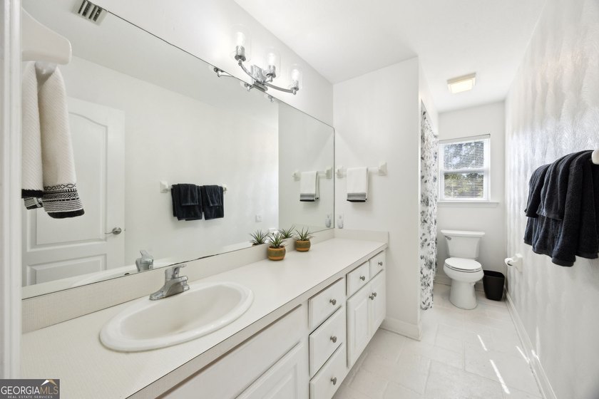 THIS BEAUTIFULLY UPDATED THREE-BEDROOM HOME IN OSPREY COVE IS - photo 33