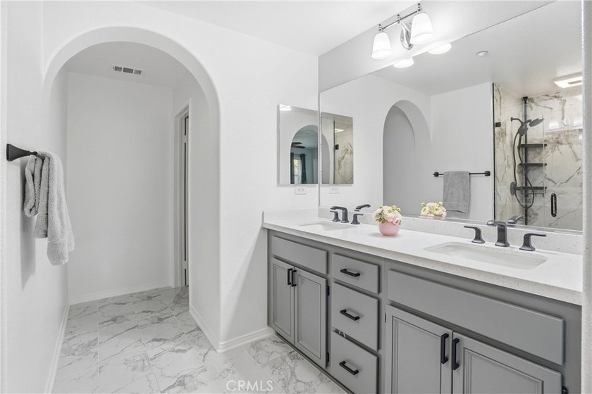 Welcome to this highly upgraded three-bedroom residence in the - photo 13