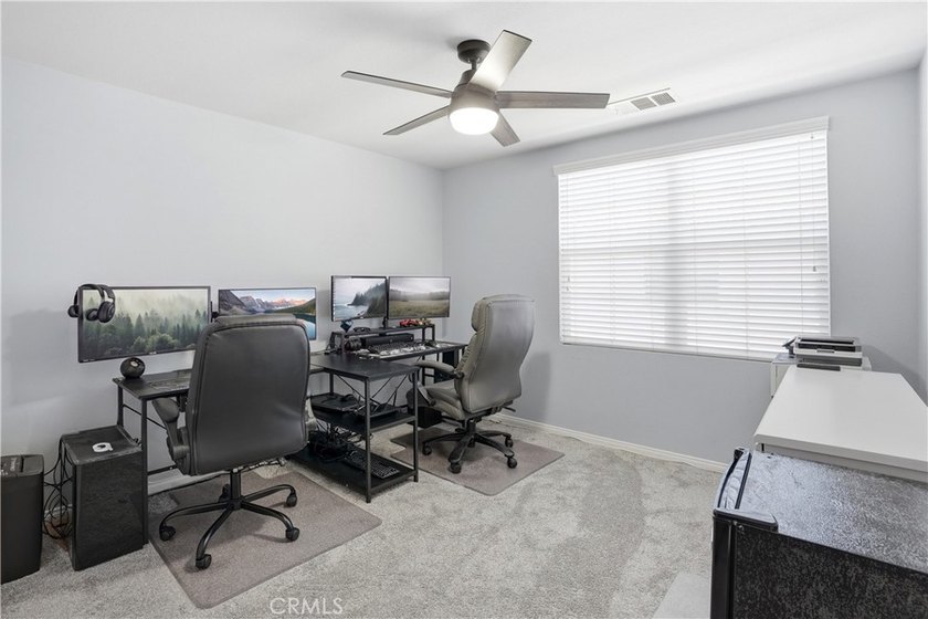 Welcome to this highly upgraded three-bedroom residence in the - photo 17