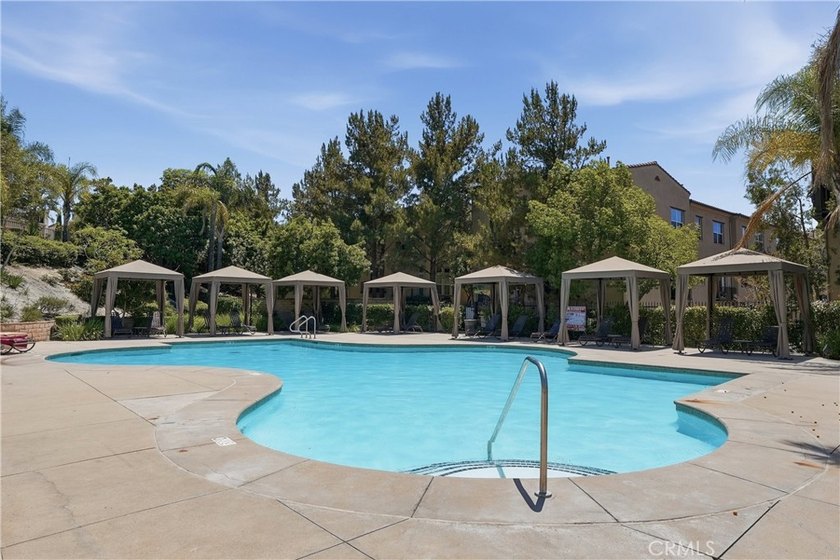 Welcome to this highly upgraded three-bedroom residence in the - photo 22