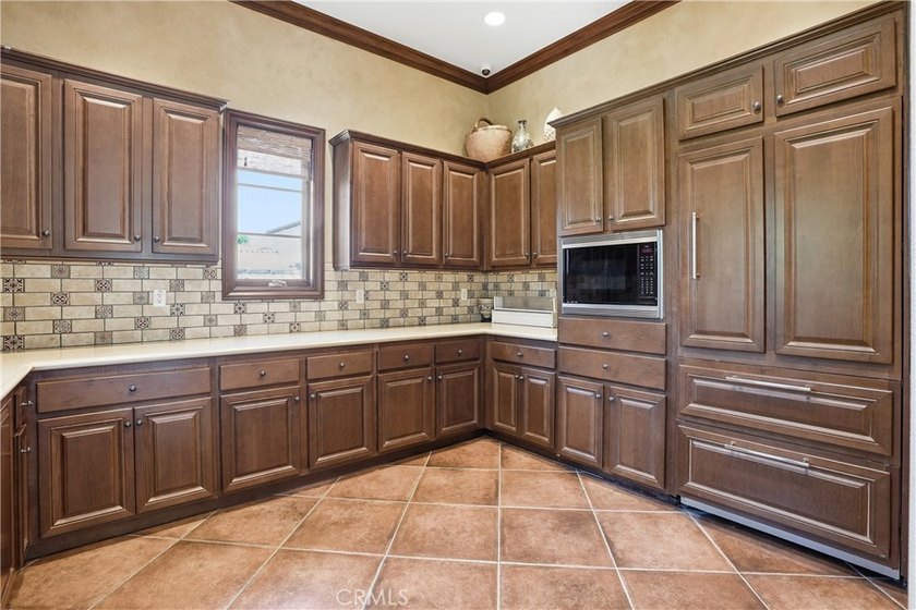 Welcome to this highly upgraded three-bedroom residence in the - photo 27