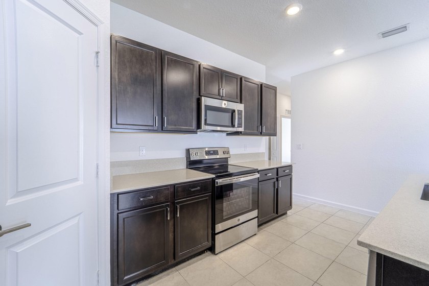 Beautiful updated 4 bedroom home in a gated community. New - photo 10