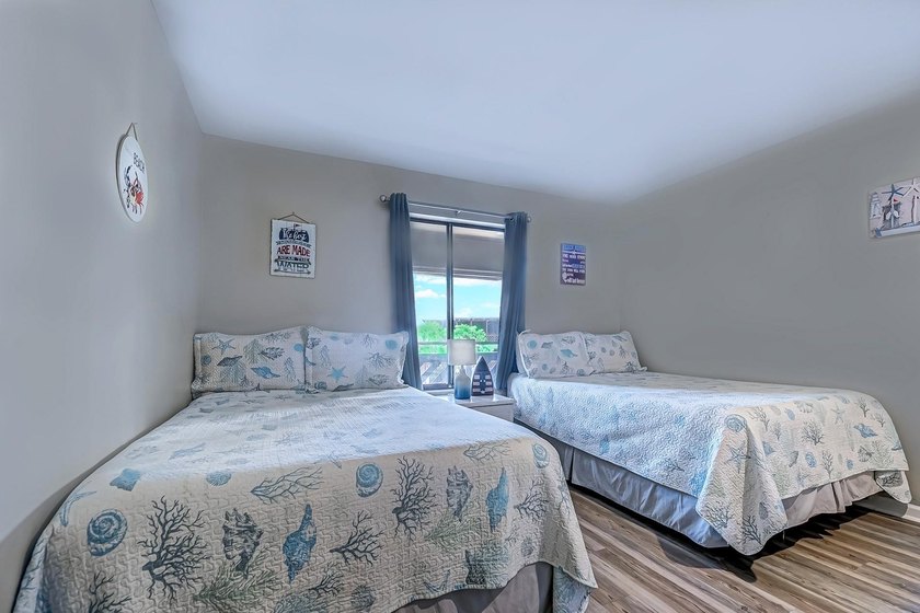Relax in the large 3rd floor end unit with an Oceanview. The - photo 21