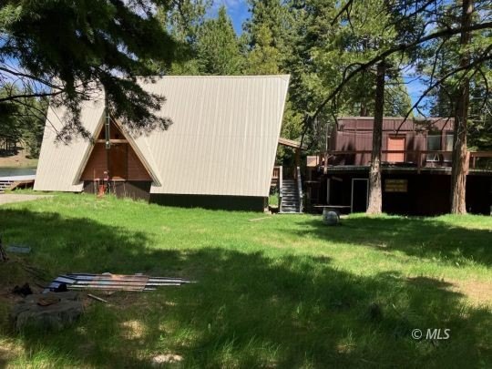 The main A-frame house and two smaller A-frame cabins over - photo 11