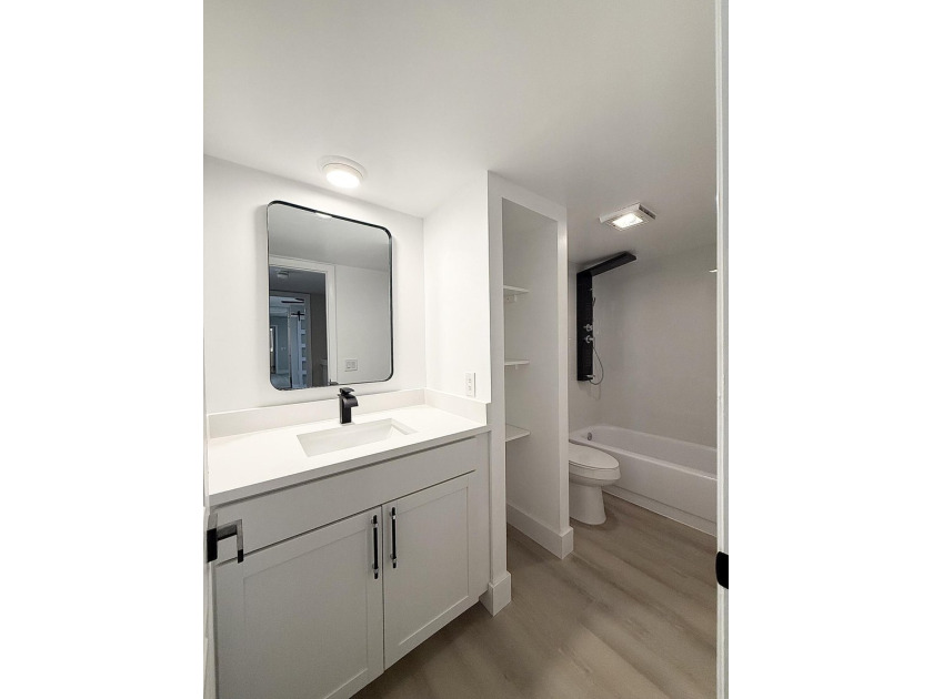 Beautifully renovated townhome, updated top to bottom, with - photo 12