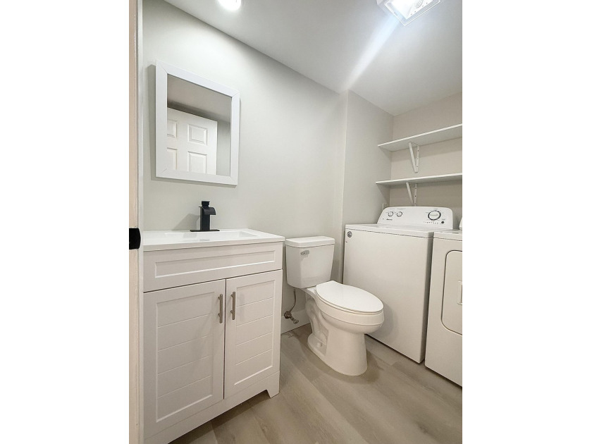 Beautifully renovated townhome, updated top to bottom, with - photo 18