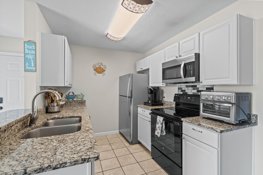 Welcome to this charming 2-bedroom, 2-bathroom condo located - photo 13