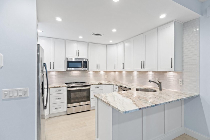 Welcome to this charming 2-bedroom, 2.5-bath condominium in the - photo 13