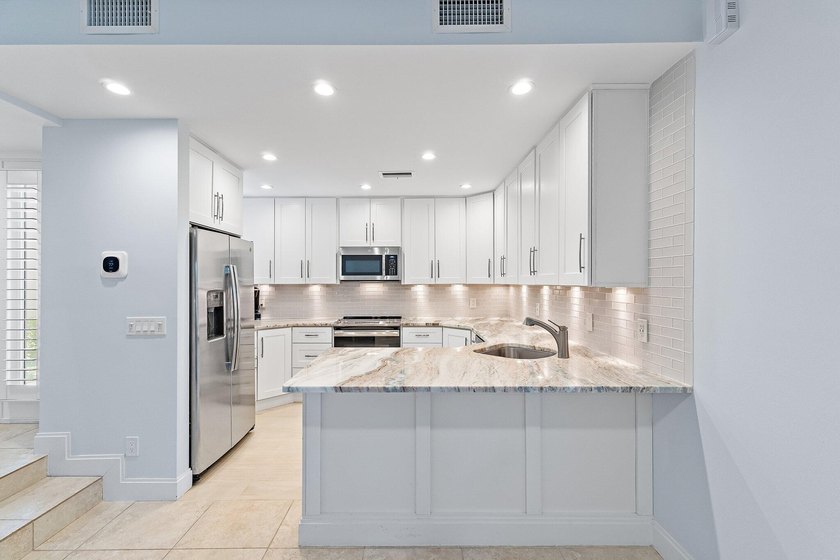 Welcome to this charming 2-bedroom, 2.5-bath condominium in the - photo 14