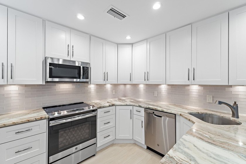 Welcome to this charming 2-bedroom, 2.5-bath condominium in the - photo 15