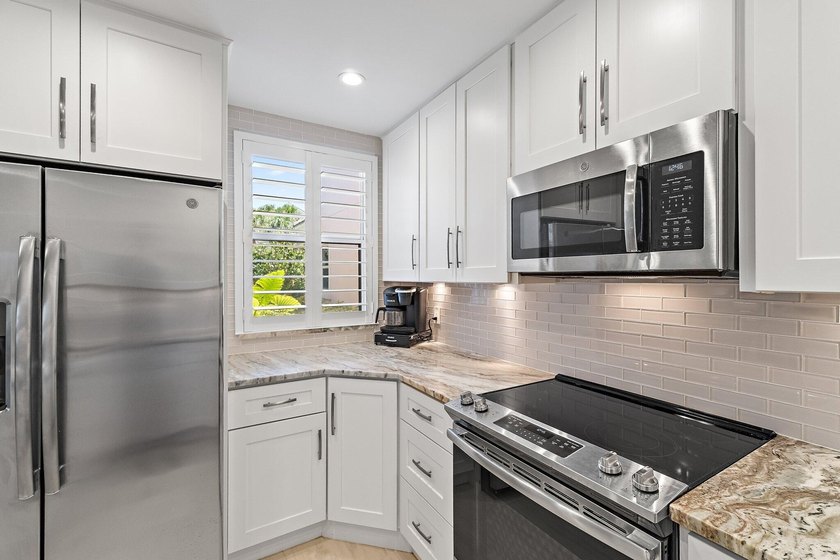 Welcome to this charming 2-bedroom, 2.5-bath condominium in the - photo 16