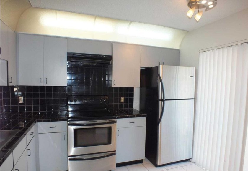 Spacious second-floor 2BR/2BA condo offering 1,200 Sq. Ft. of - photo 2