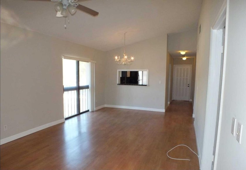 Spacious second-floor 2BR/2BA condo offering 1,200 Sq. Ft. of - photo 3