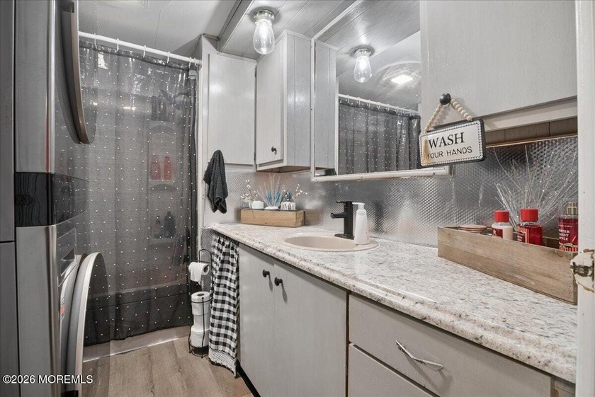 Welcome home! This stylish mobile home offers two bedrooms, a - photo 12
