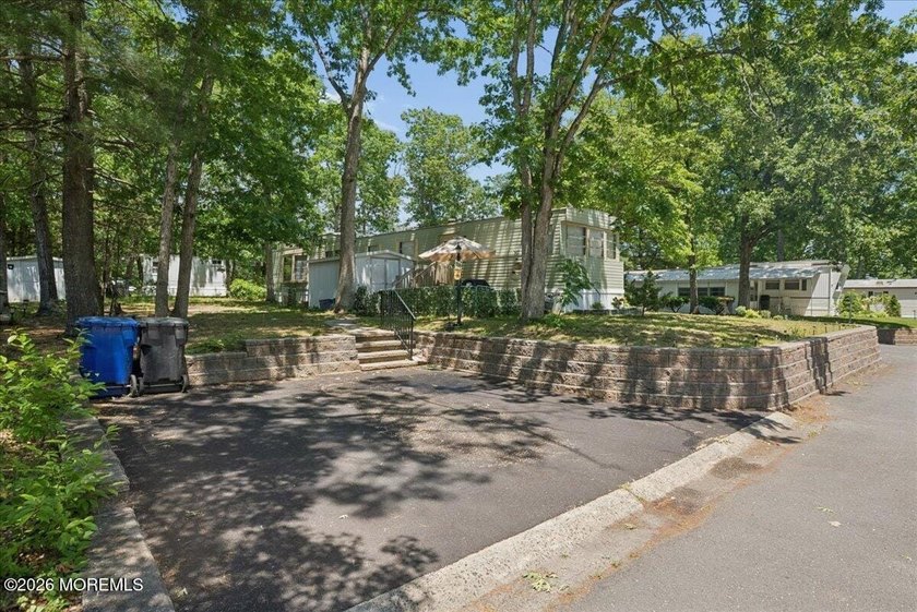 Welcome home! This stylish mobile home offers two bedrooms, a - photo 18