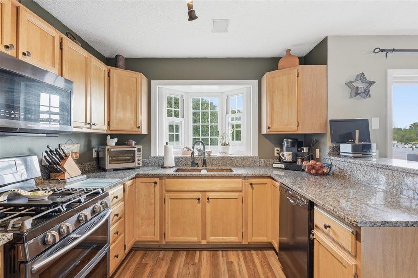 Set on 1.17 private acres in the heart of Grand Isle, this - photo 11