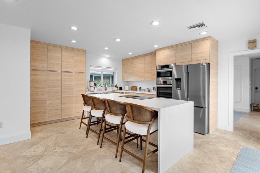 Welcome to this exceptional single-story waterfront residence in - photo 12