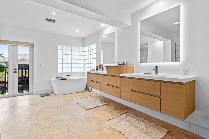Welcome to this exceptional single-story waterfront residence in - photo 21