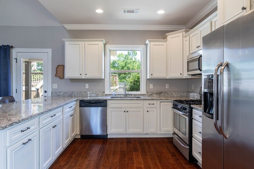 Tucked into The Lakes subdivision on 1.9 acres that includes - photo 3